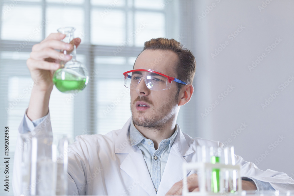 scientist chemist with the flask in hand scientist chemist with the flask in hand