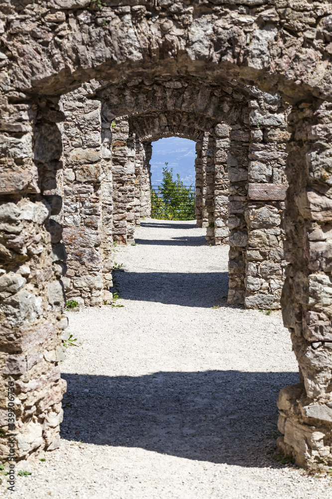 Passage in ruin Castel Belfort in Italy