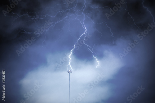 Fotobehang Lightning rod against a cloudy dark sky. Natural electric energy.