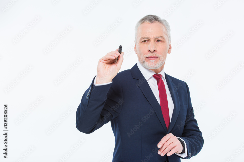 Businessman writing with marker