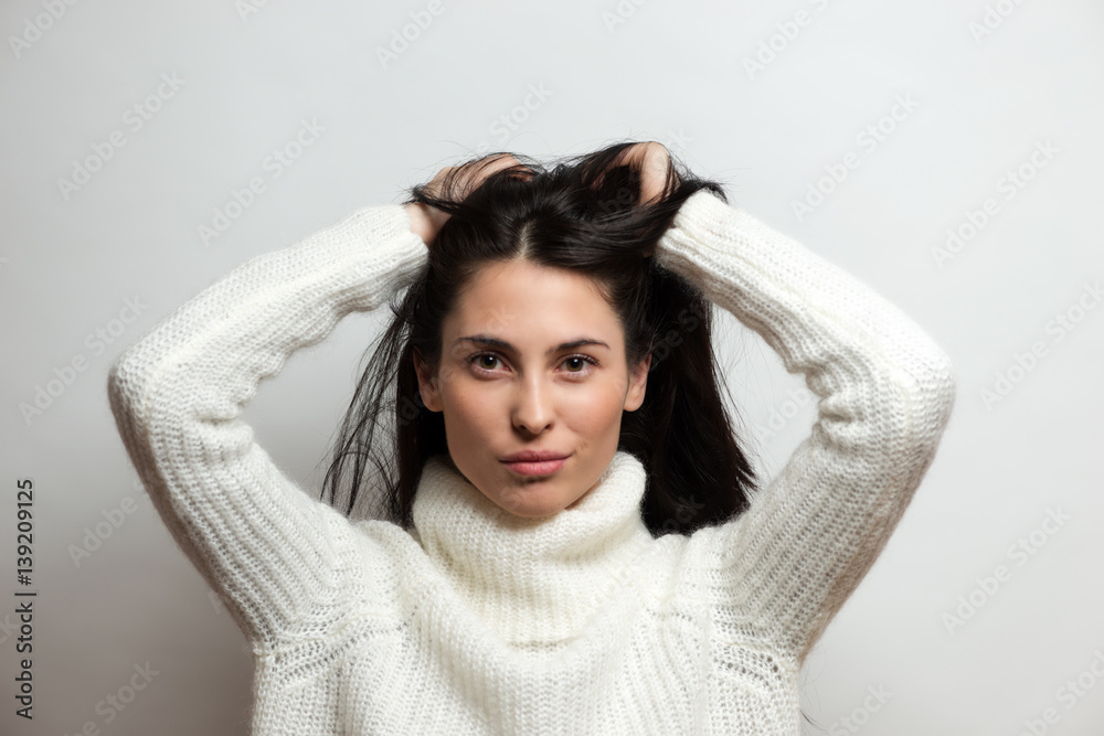 Naklejka premium Beautiful brunette woman intense close up portrait on white background.