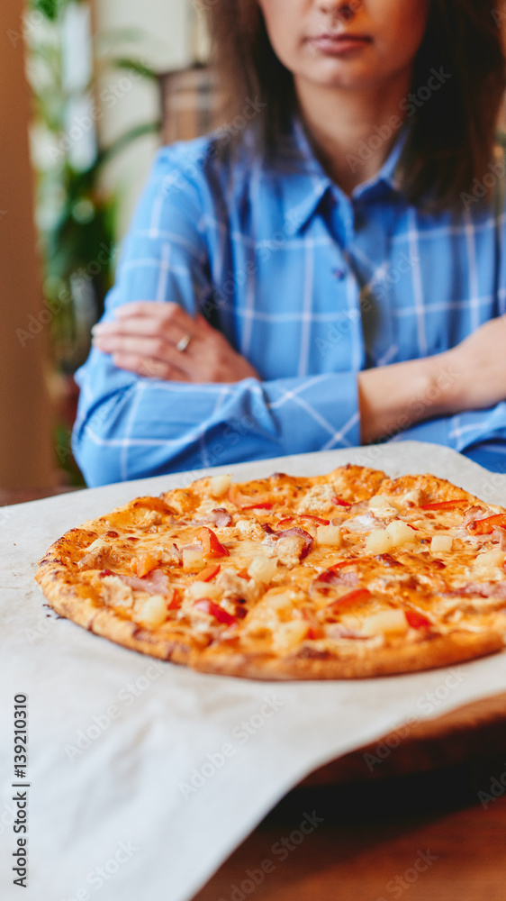 Woman eating pizza in restaurant Woman eating pizza in restaurant