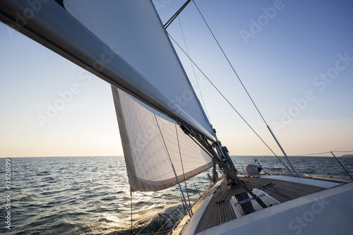Luxury Boat Sailing In Sea During Sunset © Tyler Olson