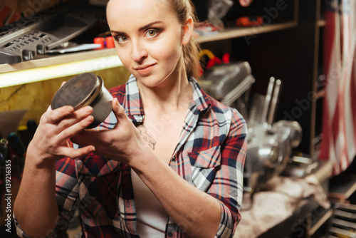 Close up photo of pretty girl holding tin