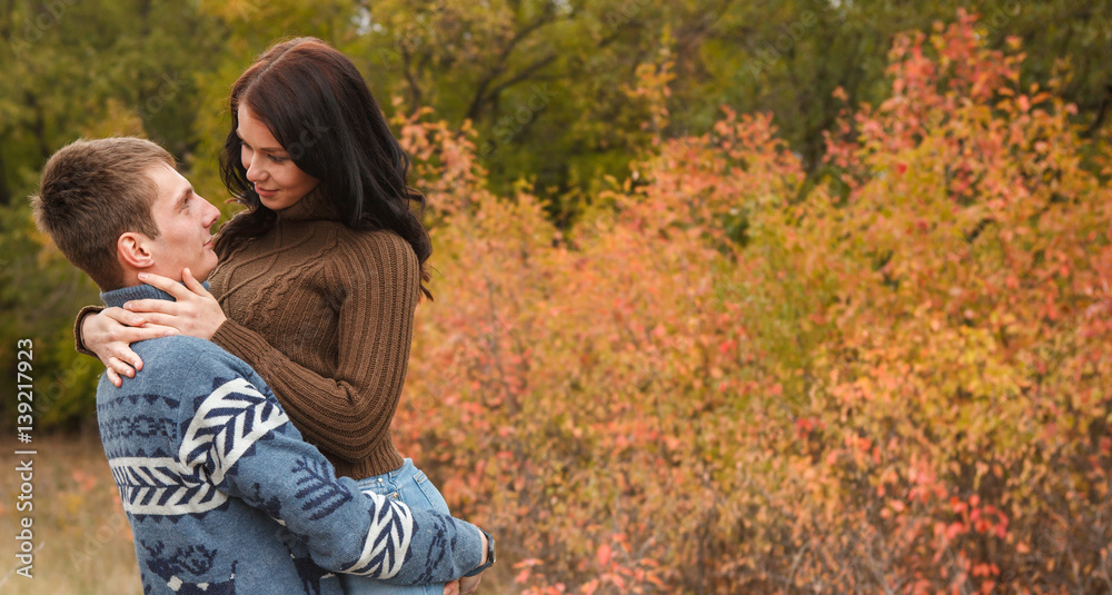 girl at the hands of Man. A loving couple walking in the autumn park. girl at the hands of Man. A loving couple walking in the autumn park.