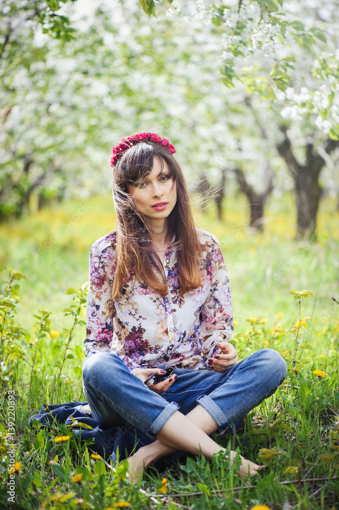woman resting in a cherry garden woman resting in a cherry garden