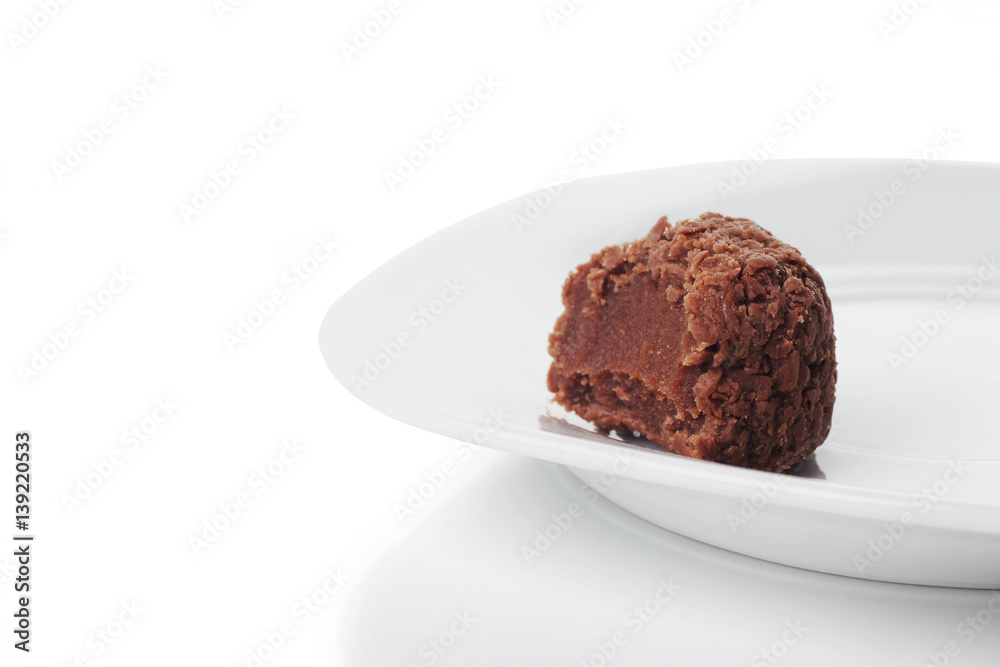 Traditional candy from Brazil called brigadeiro over white background Traditional candy from Brazil called brigadeiro over white background