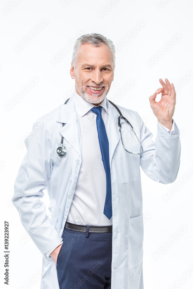 Mature doctor with stethoscope Mature doctor with stethoscope