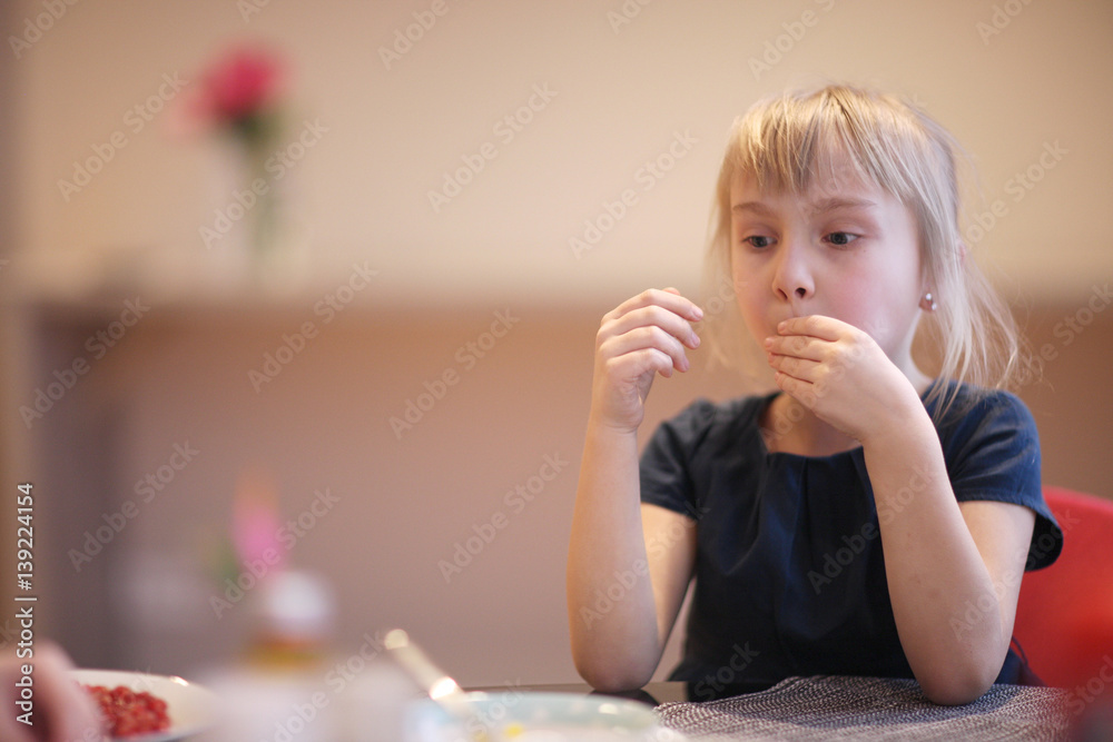 Girl sits at a table in a cafe. Girl sits at a table in a cafe.