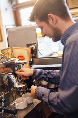 Man Making Coffee with a CoffeeMachine.