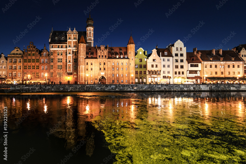 Poland, Gdansk, old town, Motlawa river with St. Mary's Gate at night Poland, Gdansk, old town, Motlawa river with St. Mary's Gate at night