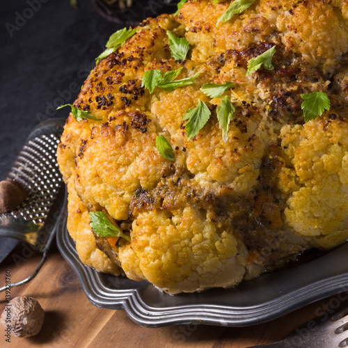 Stuffed cauliflower with mince and Hasselback potatoes photo