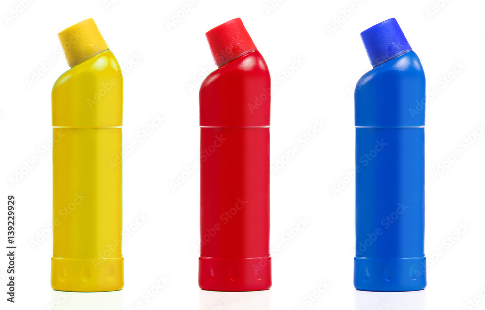 Yellow, blue, red bottle for means for cleaning of plumbing fixtures isolated on white background. Bottle with cleaner agent for bathroom equipment Yellow, blue, red bottle for means for cleaning of plumbing fixtures isolated on white background. Bottle with cleaner agent for bathroom equipment