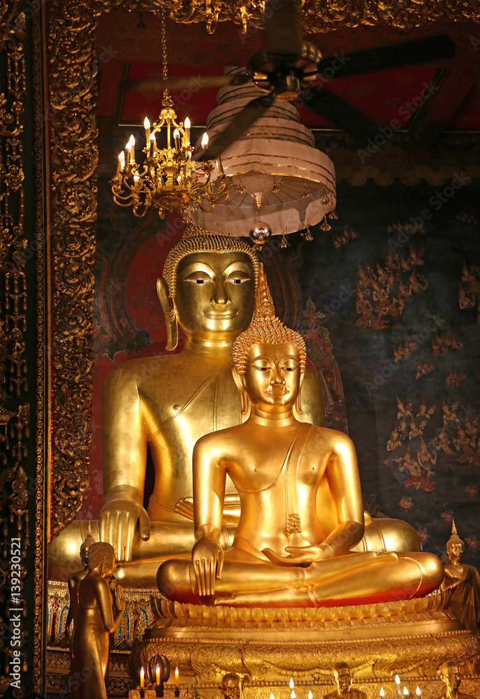 Beautiful of golden Buddha statue and thai art architecture in Wat Bovoranives, Bangkok, Thailand.