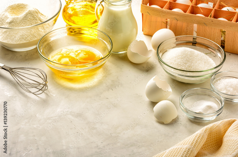Ingredients for making pancakes on a white background. Copy space. Ingredients for making pancakes on a white background. Copy space.