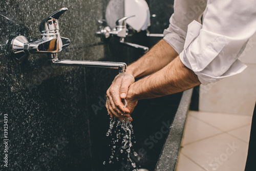 Muslim man cleaning himself before the prayer