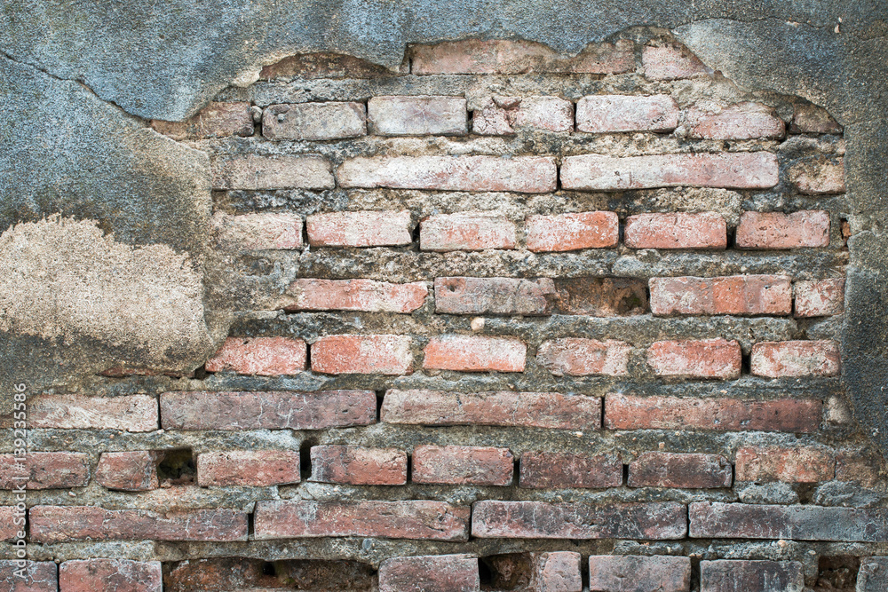Fototapeta premium cracked concrete vintage brick wall background