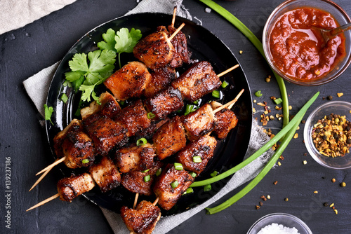 Bbq meat on wooden skewers photo