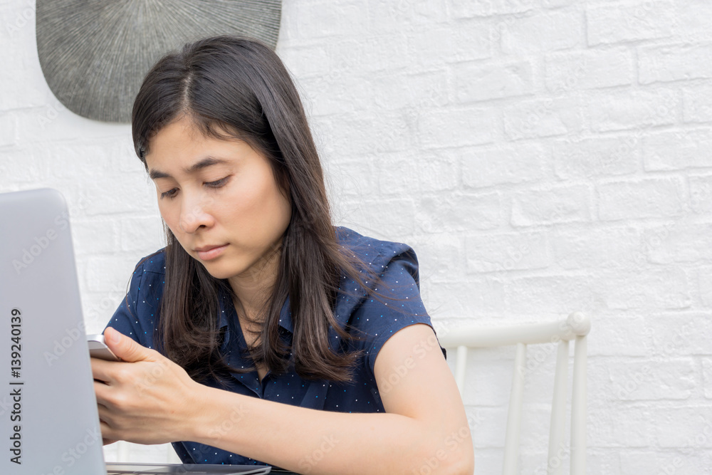 young asian woman internet on mobile phone during rest in coffee shop young asian woman internet on mobile phone during rest in coffee shop