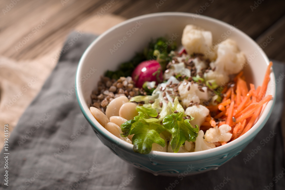 Healthy salad with buckwheat and vegetables on the blurred background Healthy salad with buckwheat and vegetables on the blurred background