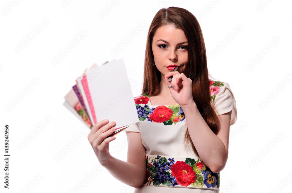 Sparkling businesswoman holding a notebook isolated on a white background Sparkling businesswoman holding a notebook isolated on a white background