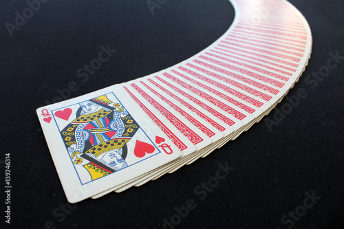 The combination of playing cards poker casino. Isolated on black poker table background