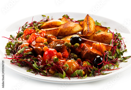 Roasted meat and potatoes with vegetables