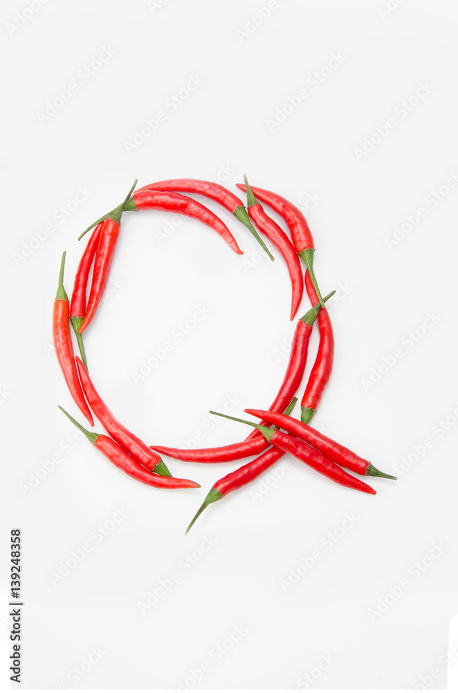 Bold letter Q Latin alphabet of red hot chili pepper on a white background Bold letter Q Latin alphabet of red hot chili pepper on a white background