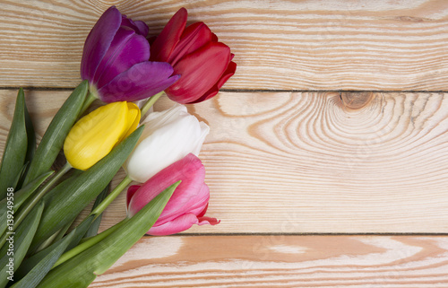 Fototapeta Naklejka Na Ścianę i Meble -  Bouquet of tulips on wooden background