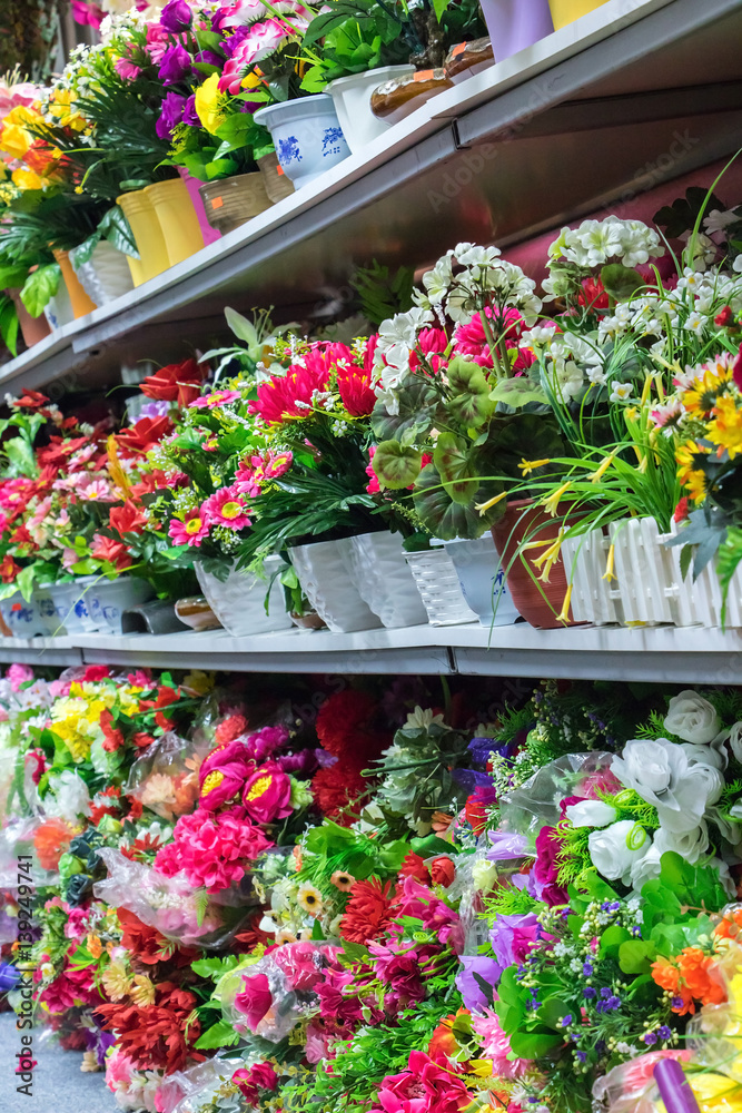 Colorful decoration artificial flower on store shelves