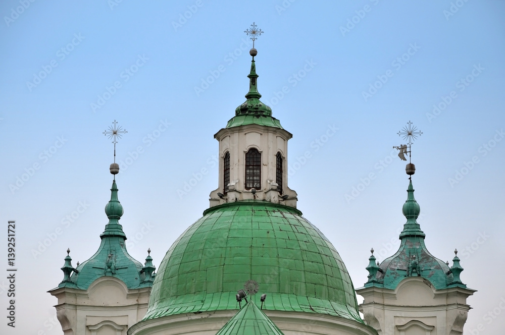 Dome and towers of the Jesuit church in Baroque style on a background of blue sky. Grodno, Belarus.