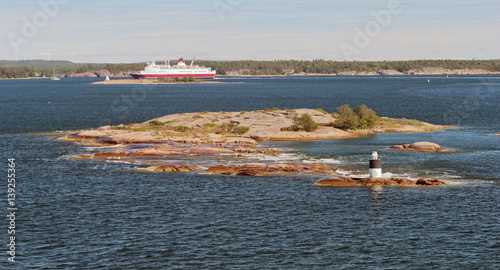 Automatic lighthouse on a small island in the archipelago of the Aland Islands, Finland photo