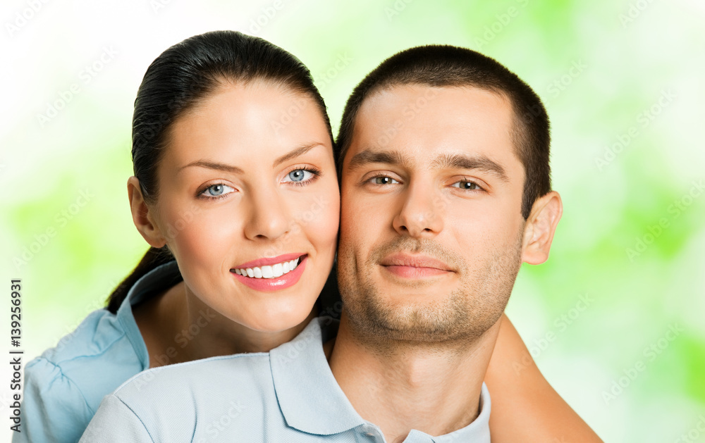 Portrait of young happy couple, outdoors Portrait of young happy couple, outdoors