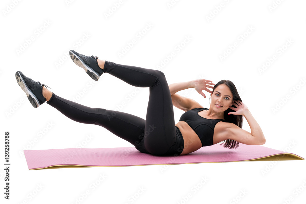 Fitness woman exercising on rubber mat at studio Fitness woman exercising on rubber mat at studio