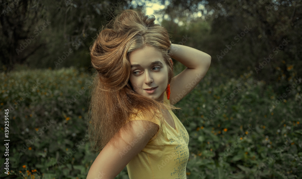 Attractive girl keeping her long blond hairs by her hand and looking away retro color, shot with copyspace. Attractive girl keeping her long blond hairs by her hand and looking away retro color, shot with copyspace.