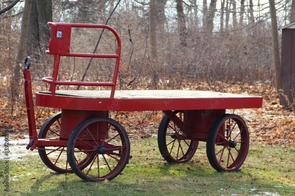 Red Cart with 4 wheels in the forest park