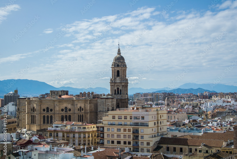 A panoramic view to Malaga city and its cathedral with mountains at the background.