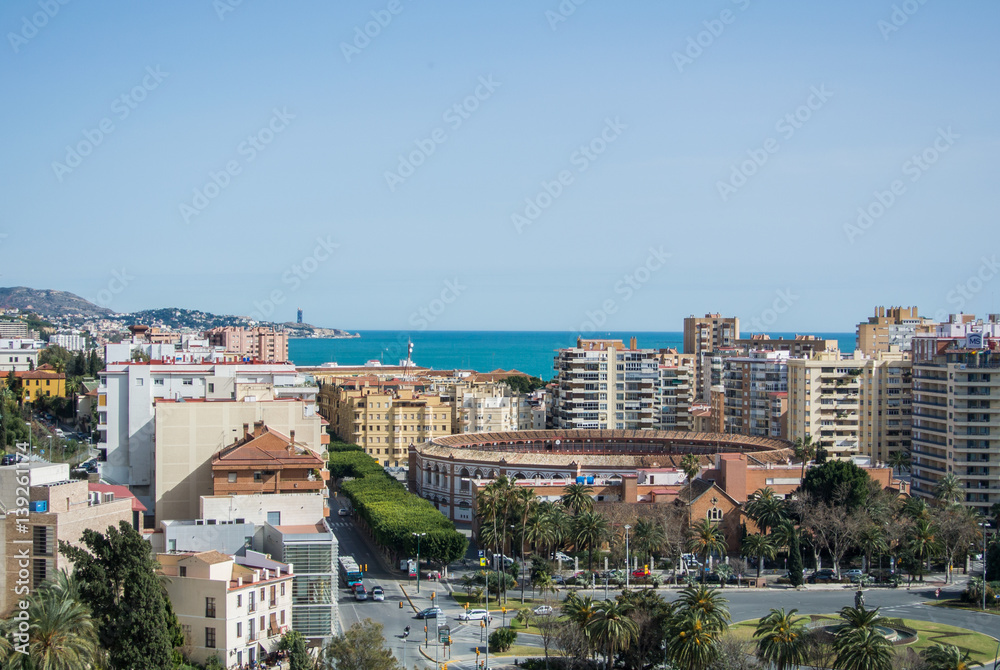 An iconic panoramic view from a castle of Malaga to the city and Mediterranean sea, Andalusia, Spain.