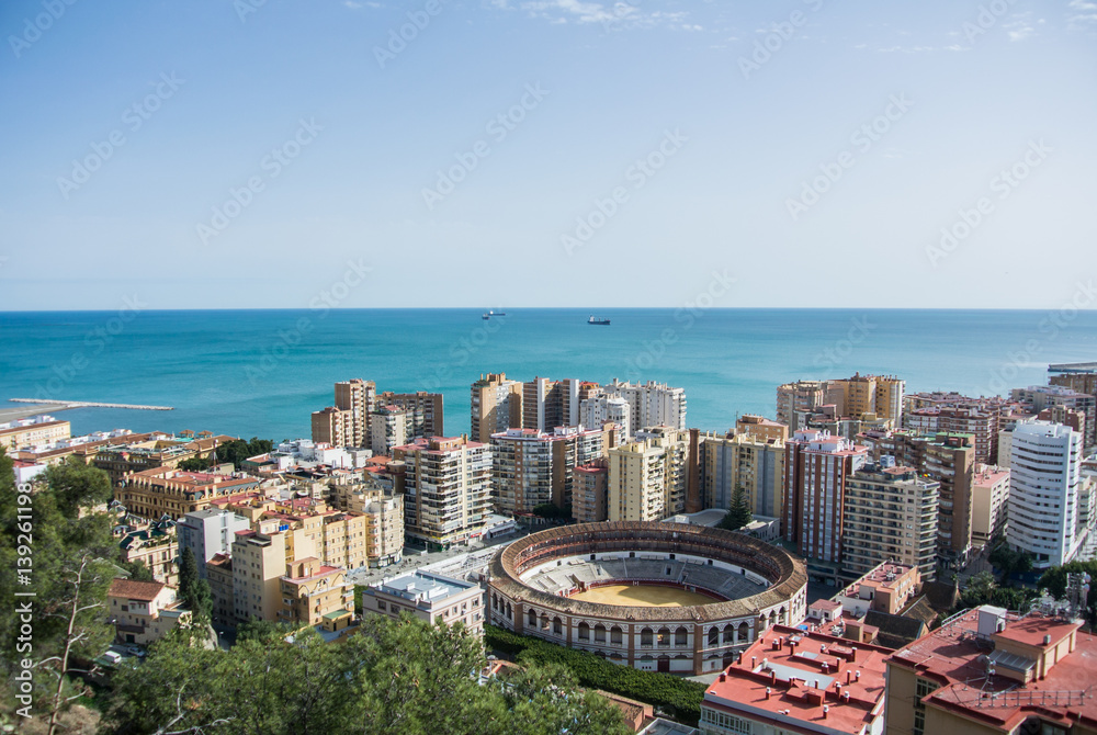 An iconic panoramic view from a castle of Malaga to the city and Mediterranean sea, Andalusia, Spain.