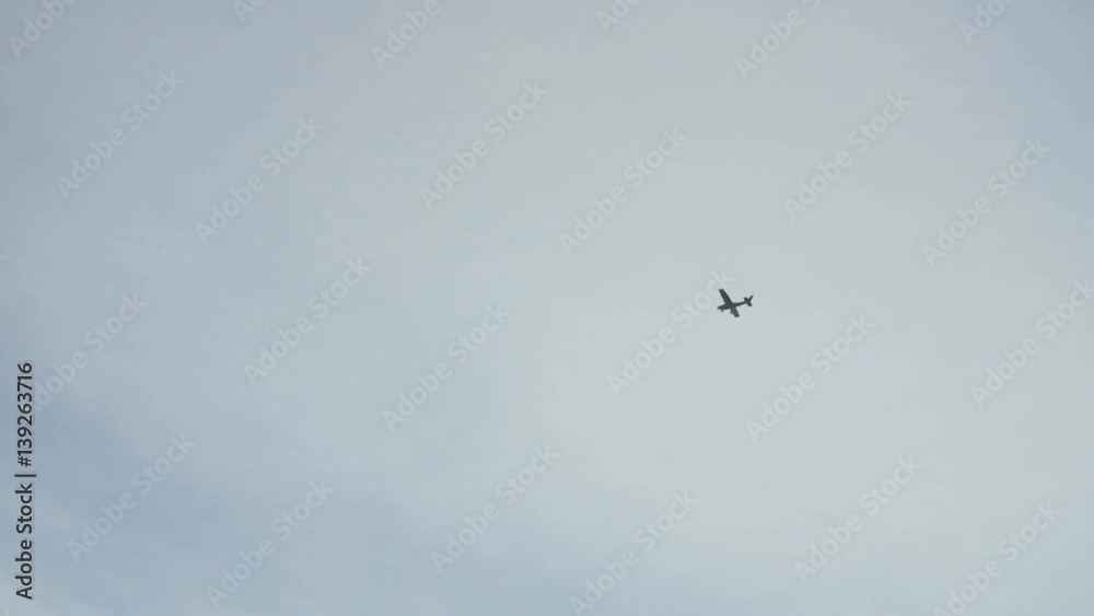 Small airplane is flying,high in the sky, slow motion. Small airplane is flying,high in the sky, slow motion.