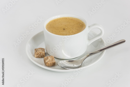 white cup of cappuccino on a white background