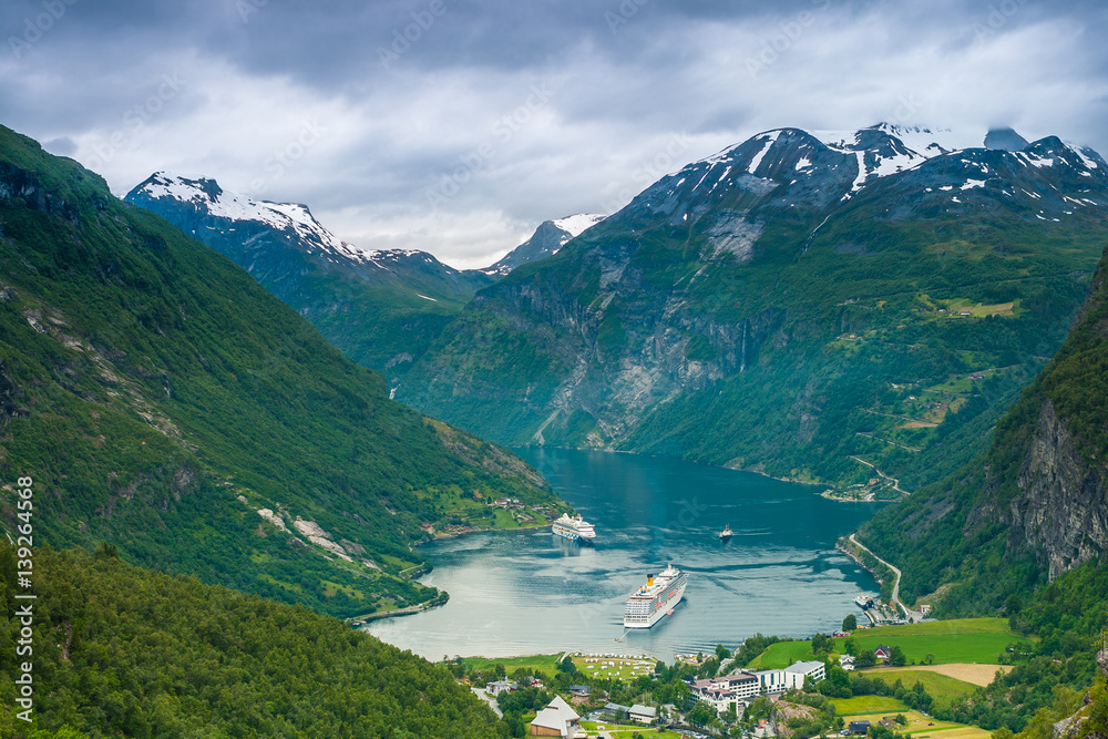 View over Geirangerfjorden and Geiranger from Flydalsjuvet viewpoint, More og Romsdal county, Norway.