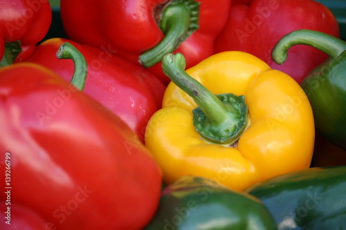 Piled red, yellow and green paprika