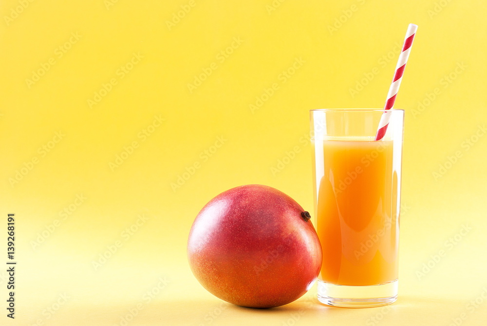 mango juice isolated on a yellow background mango juice isolated on a yellow background