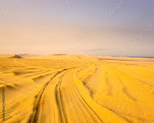 Detail of tyre tracks in sand desert