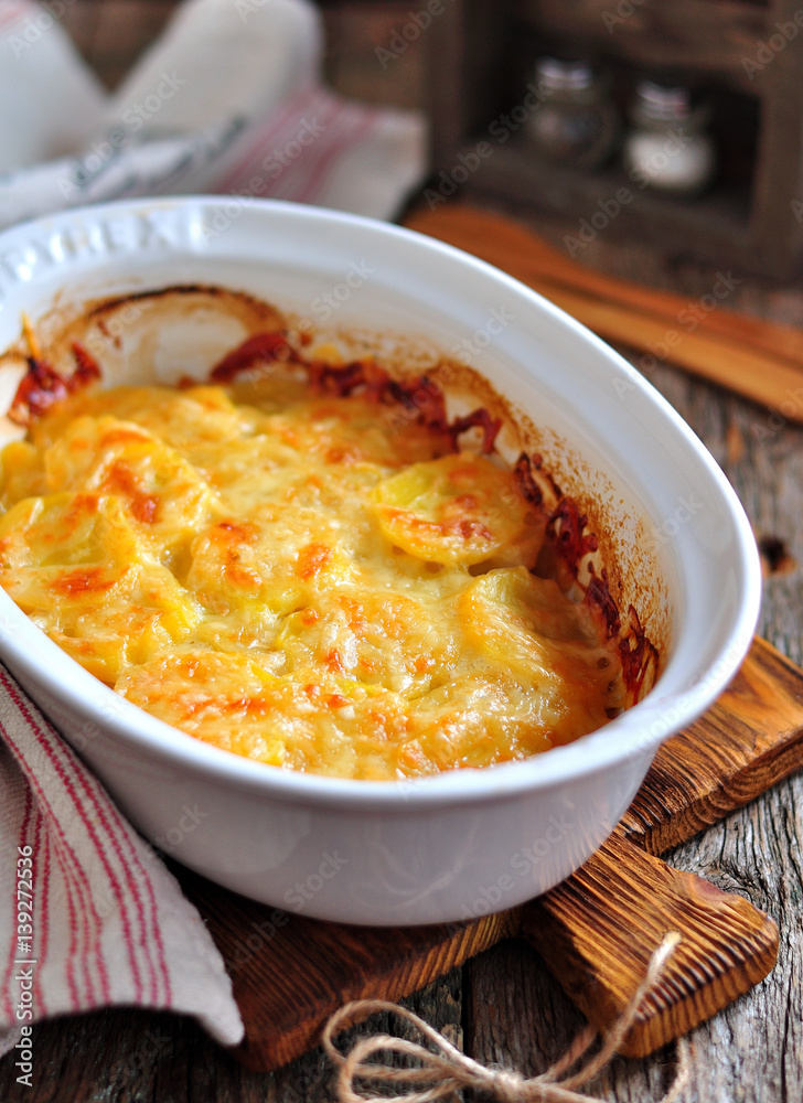 Delicious potato casserole with cheese and cream. Delicious potato casserole with cheese and cream.
