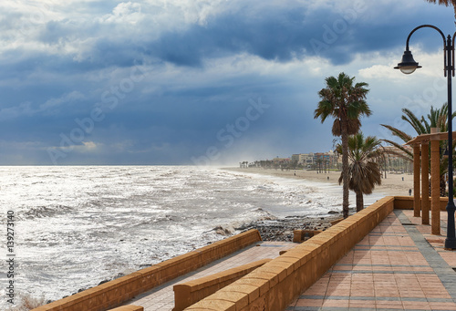 Promenade of Roquetas de Mar. Stormy weather. Spain photo