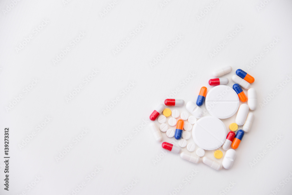 pills heart on white background pills heart on white background