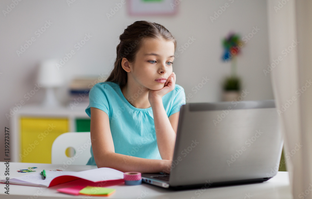 bored girl with laptop and notebook at home bored girl with laptop and notebook at home