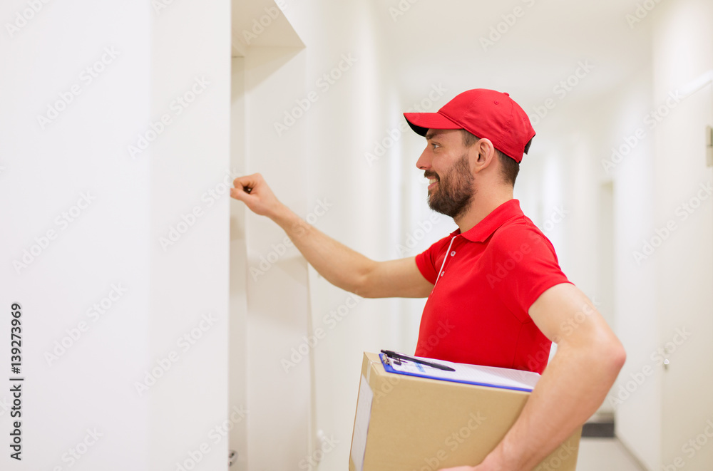 delivery man with parcel box knocking on door delivery man with parcel box knocking on door